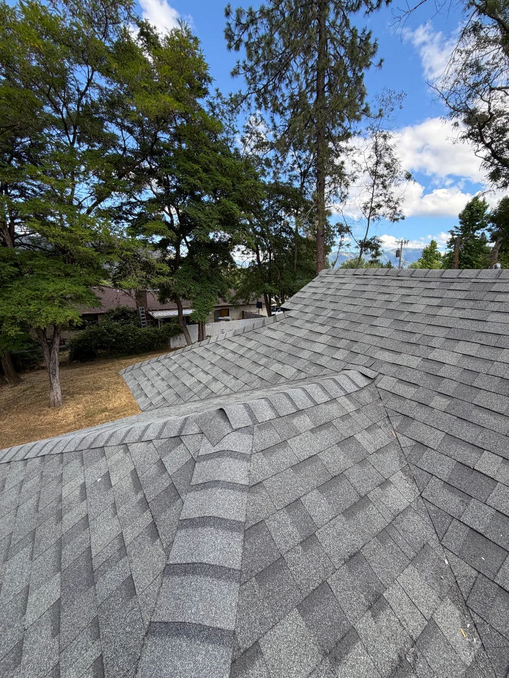Damaged Rental Roof Replaced With New Shingles in Grants Pass