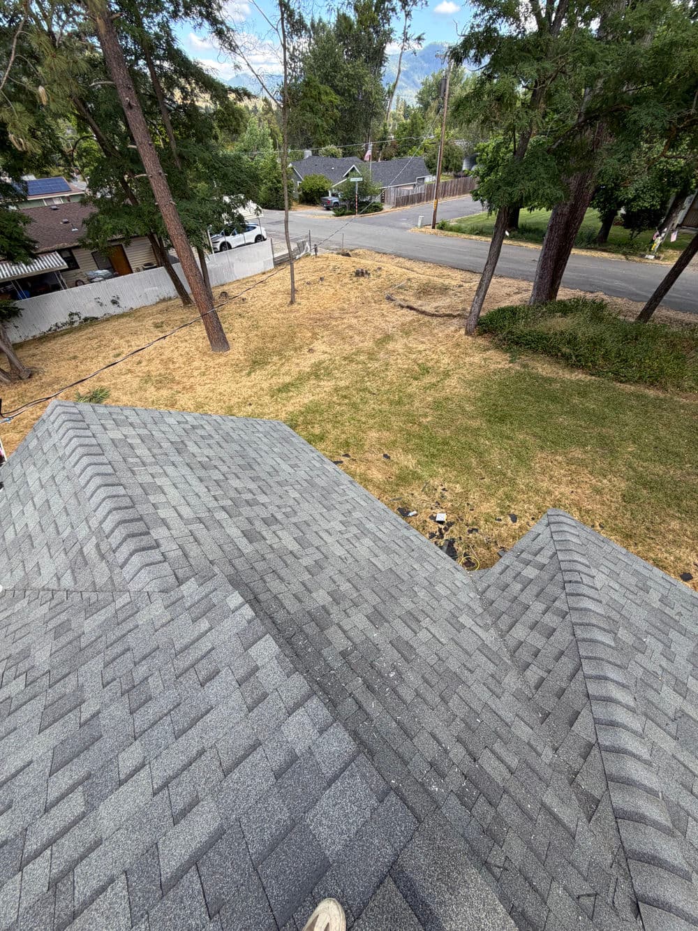 Damaged Rental Roof Replaced With New Shingles in Grants Pass